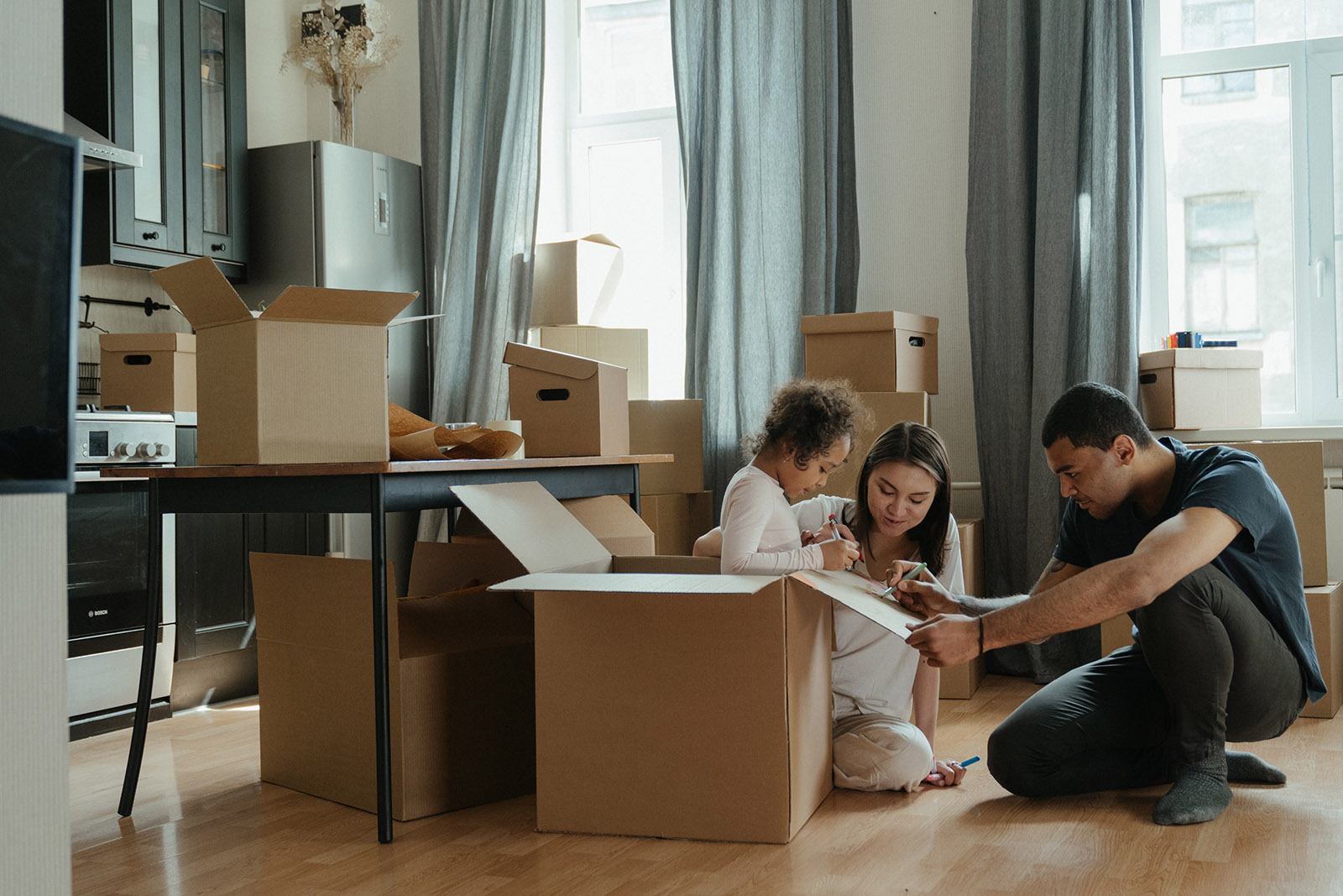 A family preparing moving boxes together